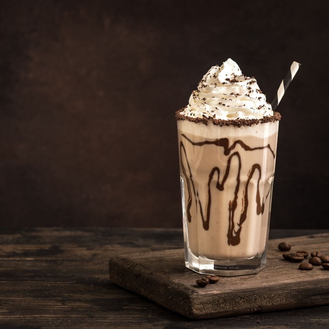 Chocolate shake with chocolate drizzle and whipped cream topping